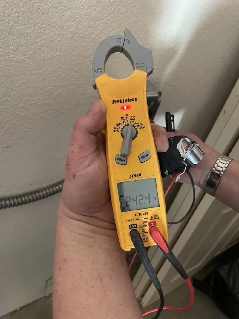 Voltage testing with clamp meter during Recessed Lighting Installation in Calhoun